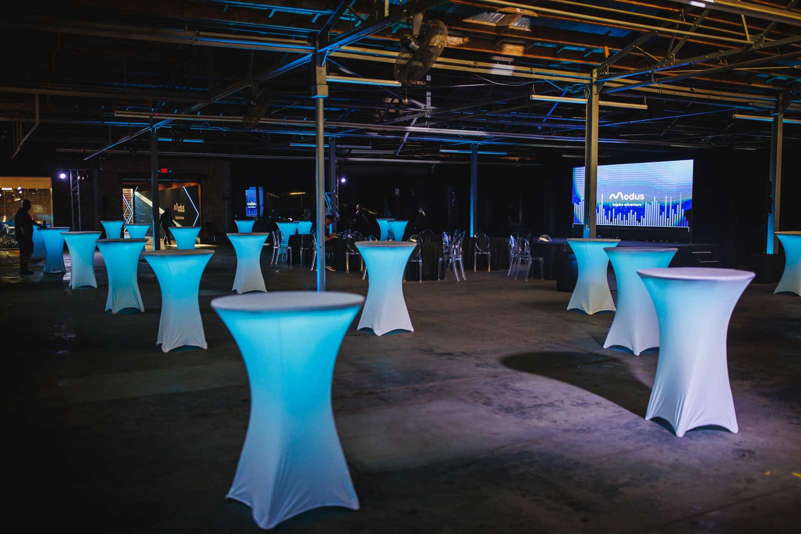Neon hexagon entry tunnel built for a corporate product launch inside the warehouse