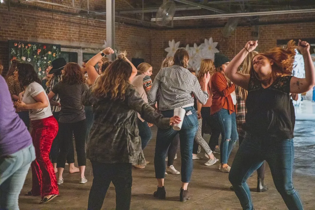 Guests dancing on the warehouse floor
