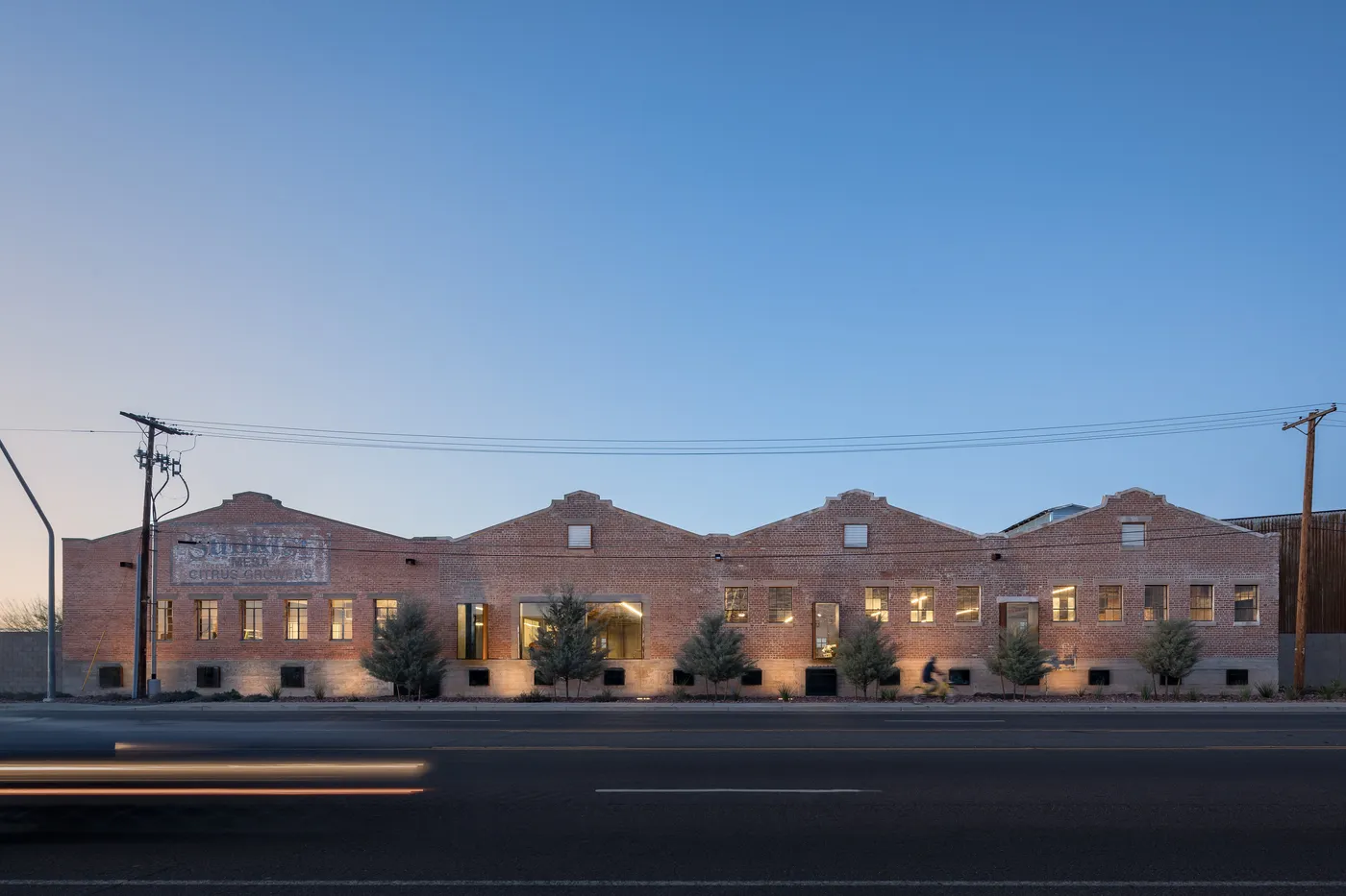 Sunkist Warehouse exterior on Broadway Road in Mesa at dusk