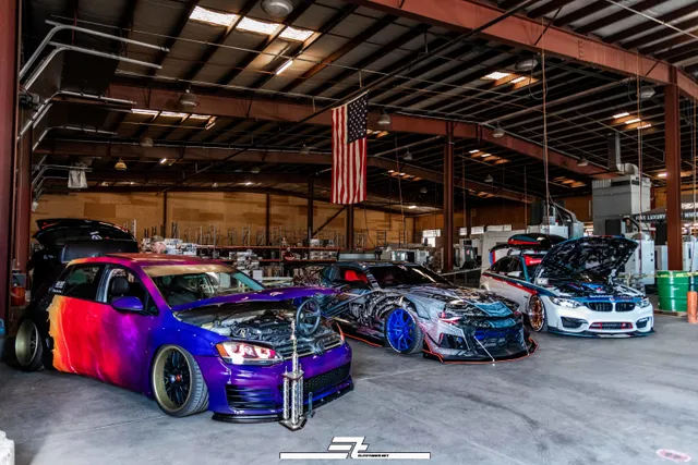 Show cars staged for a shoot inside the warehouse