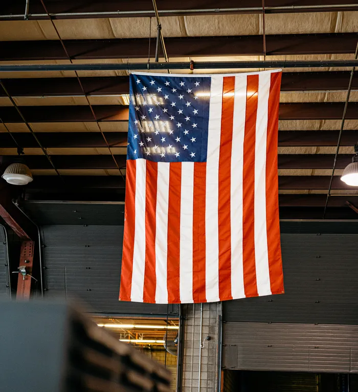 American flag hanging from the warehouse trusses