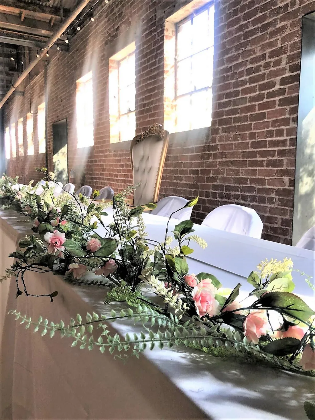 Quinceañera cake table dressed with florals